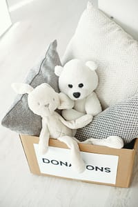 Donation box filled with pillows and stuffed animals